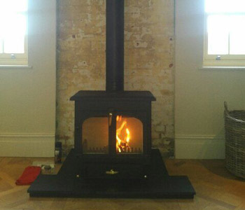Clearview Vision 500 multi fuel stove  - installed with thermally insulated twin wall chimney system in Surrey Hills. 